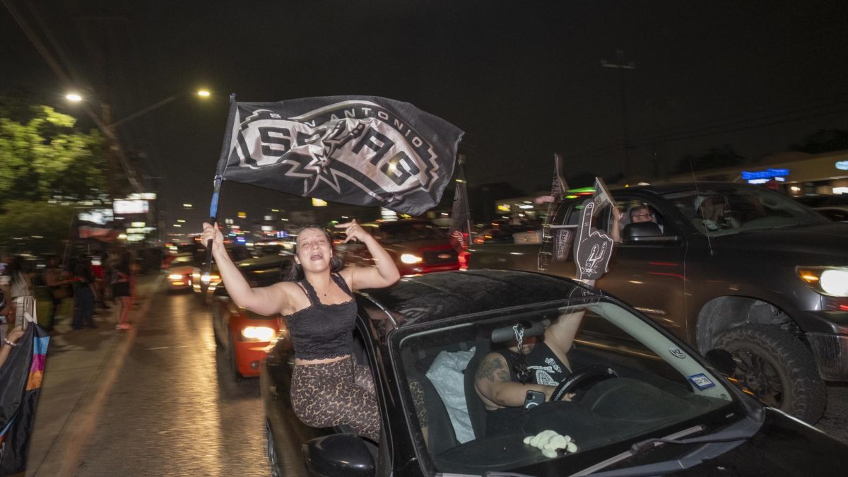San Antonio Spurs fans gather on Southwest Military Drive, honking up and down the street after a historic Game 1 win on Monday. 