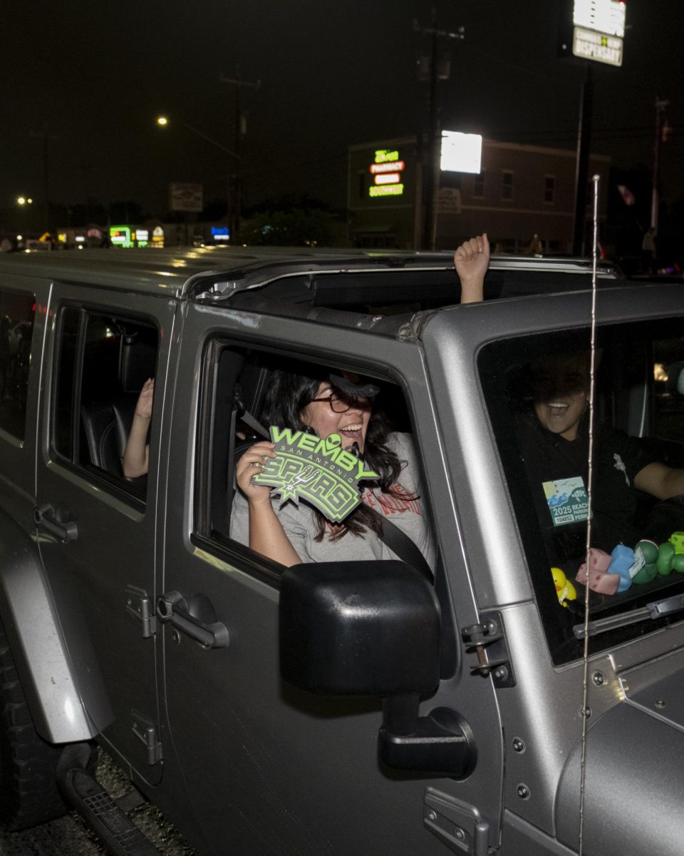 San Antonio Spurs fans gather on Southwest Military Drive, honking up and down the street after a historic Game 1 win on Monday. 