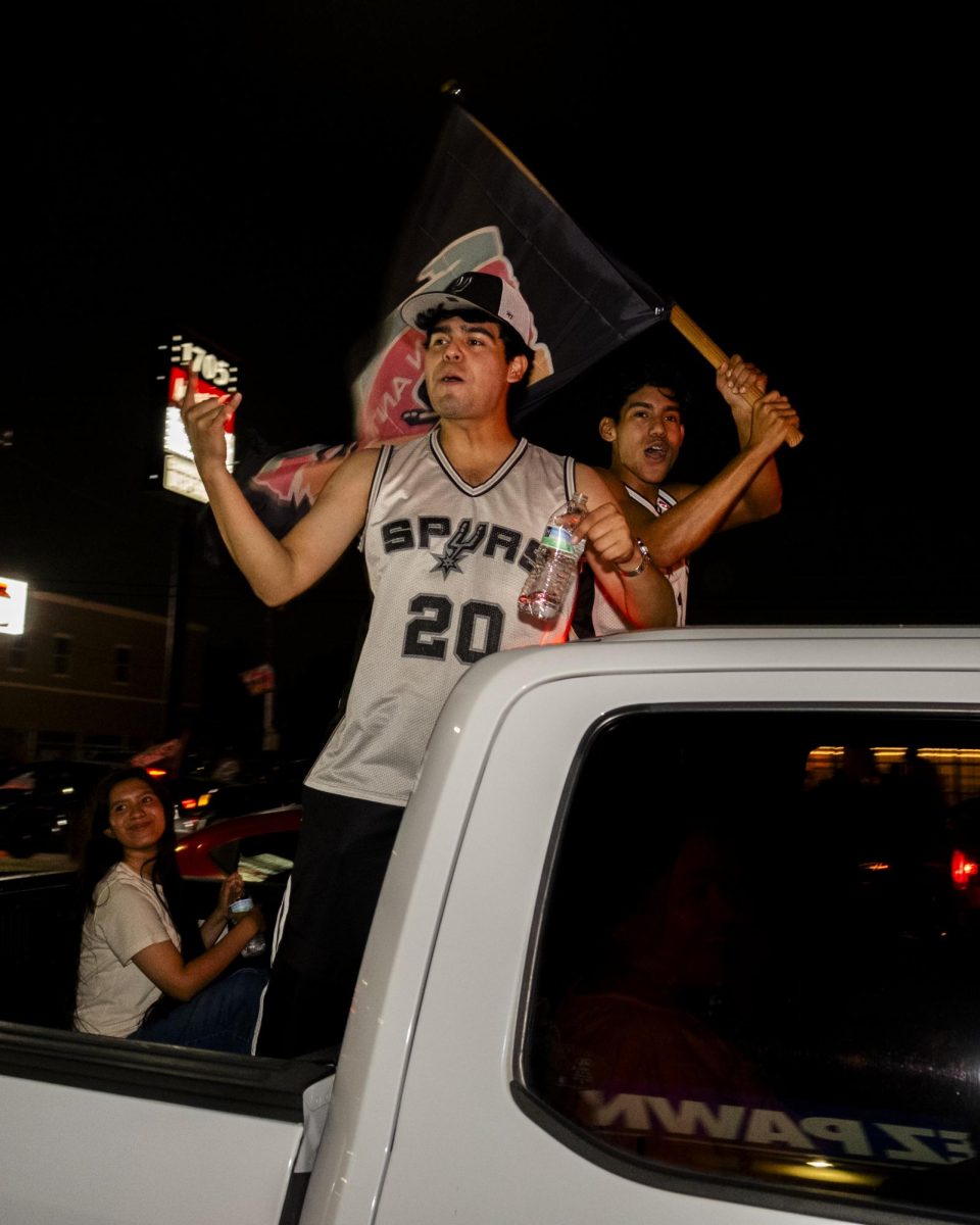 San Antonio Spurs fans gather on Southwest Military Drive, honking up and down the street after a historic Game 1 win on Monday. 