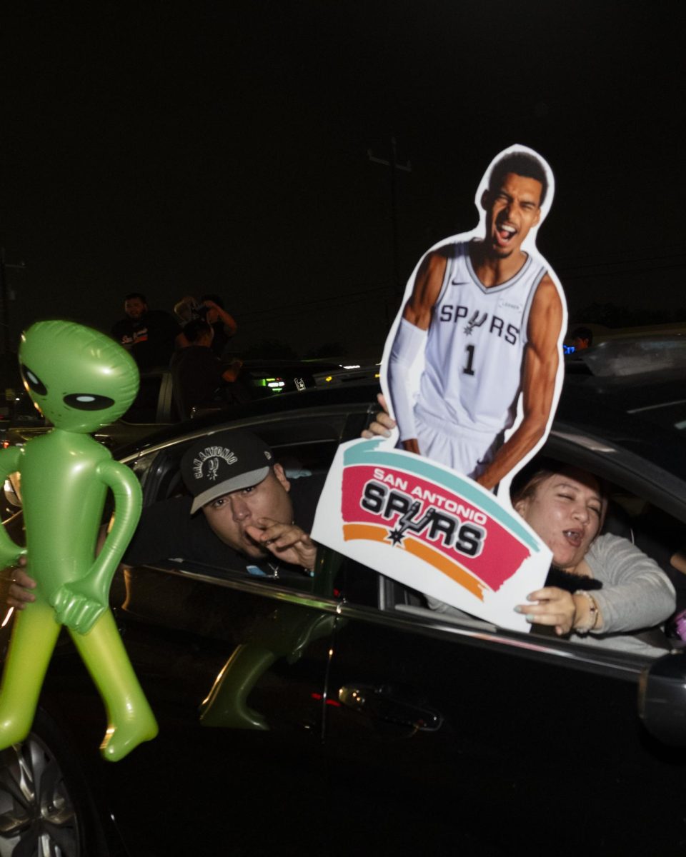 San Antonio Spurs fans gather on Southwest Military Drive, honking up and down the street after a historic Game 1 win on Monday. 
