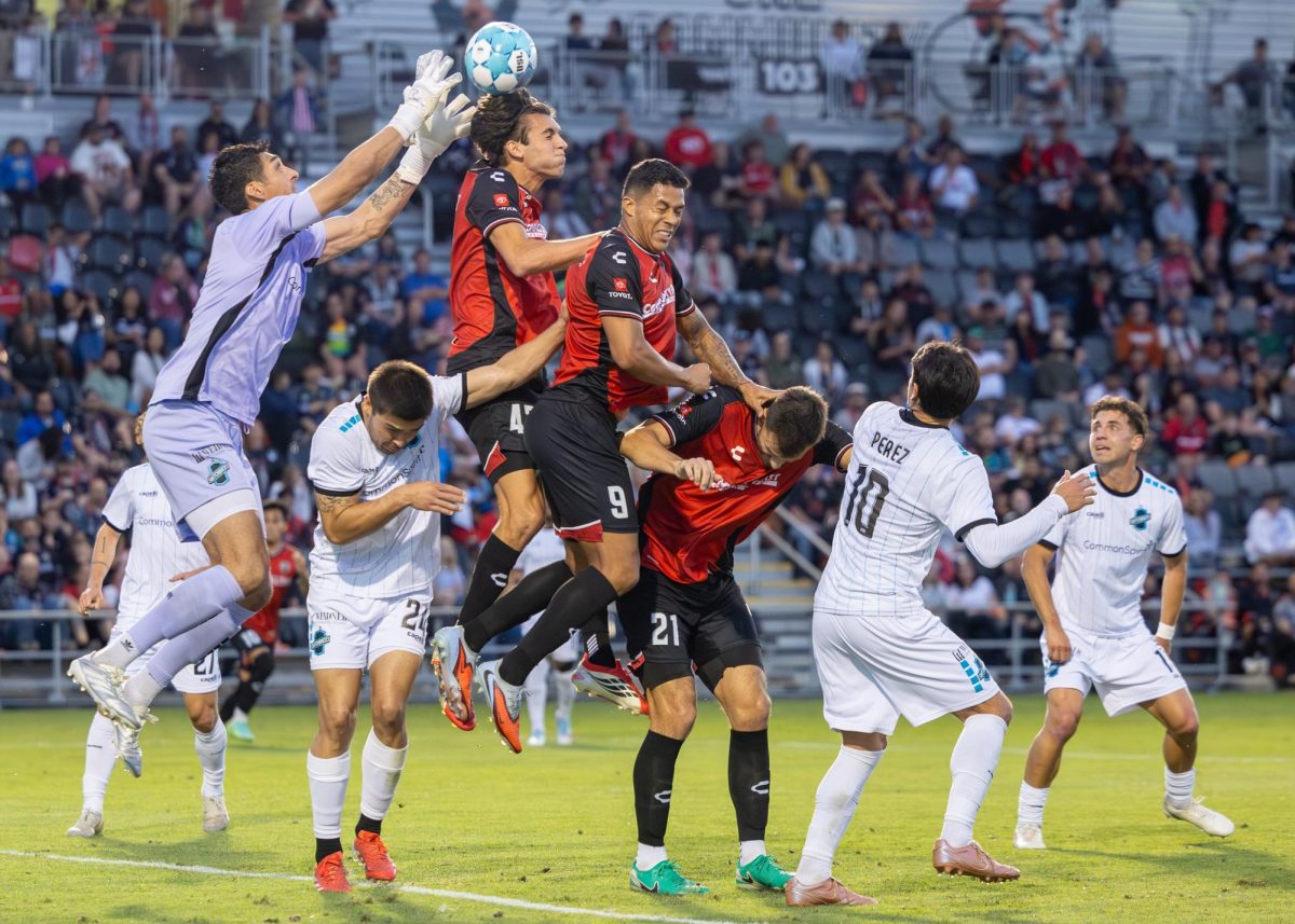 Tiago Suarez #43 fights off Switchback goalie to put the ball back in play Saturday night at Toyota Field.