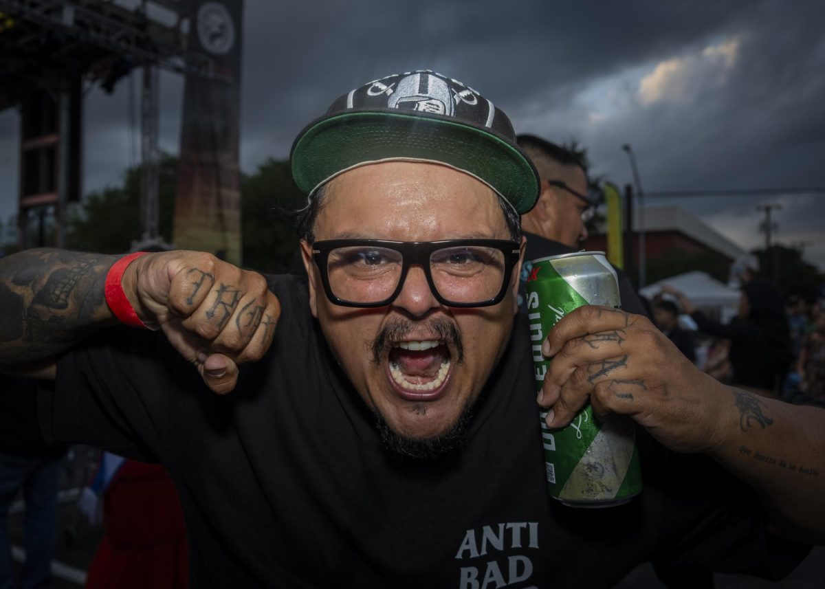 A Fredstock attendee dances along to Grupo Ma$$ore at Fredstock on Thursday.