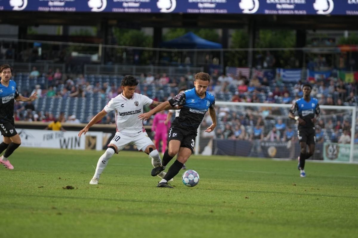SAFC midfielder Jorge Hernandez challenges FC Tulsa midfielder Grant Robinson in last Saturday's USL Cup match in Tulsa, Okla.